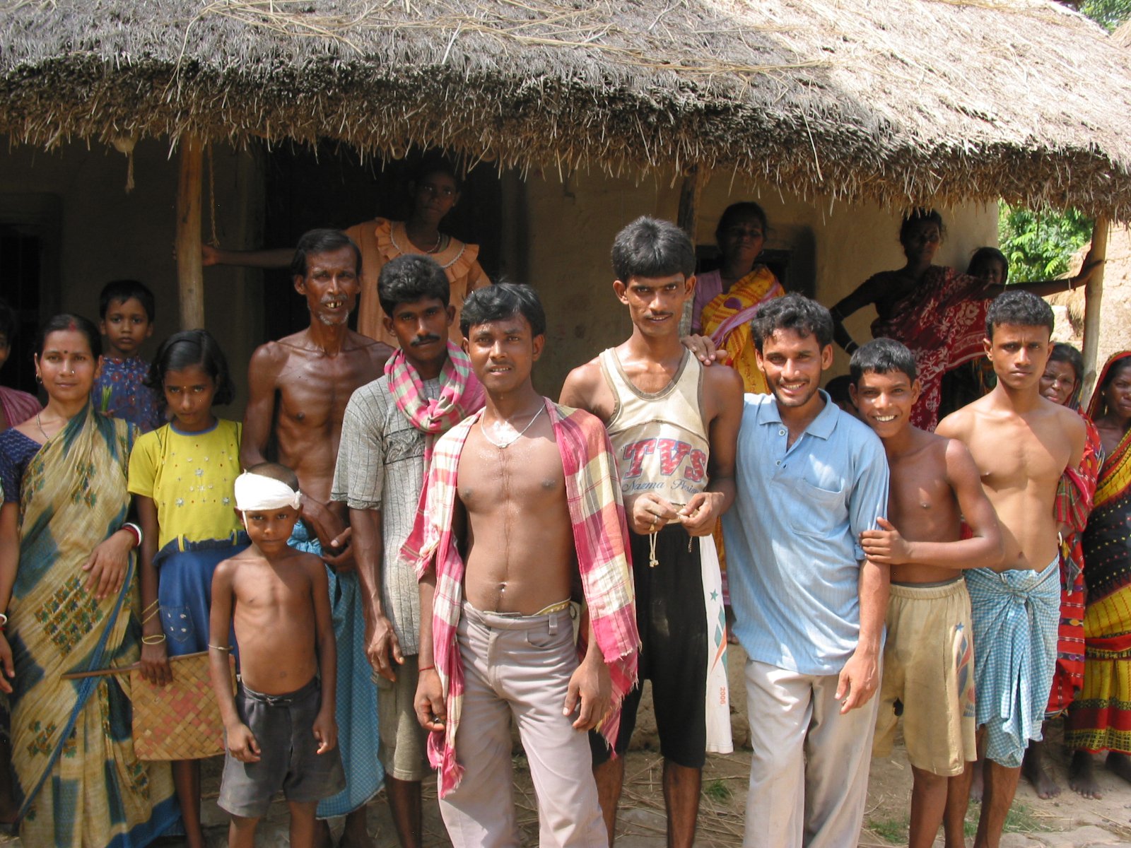 Mediabank 03570 Villagers gathered together; hut in the background Japanese Encephalitis Vaccine Introduction, West Bengal, India, July 2006. Photo: PATH/Julia Jacobson