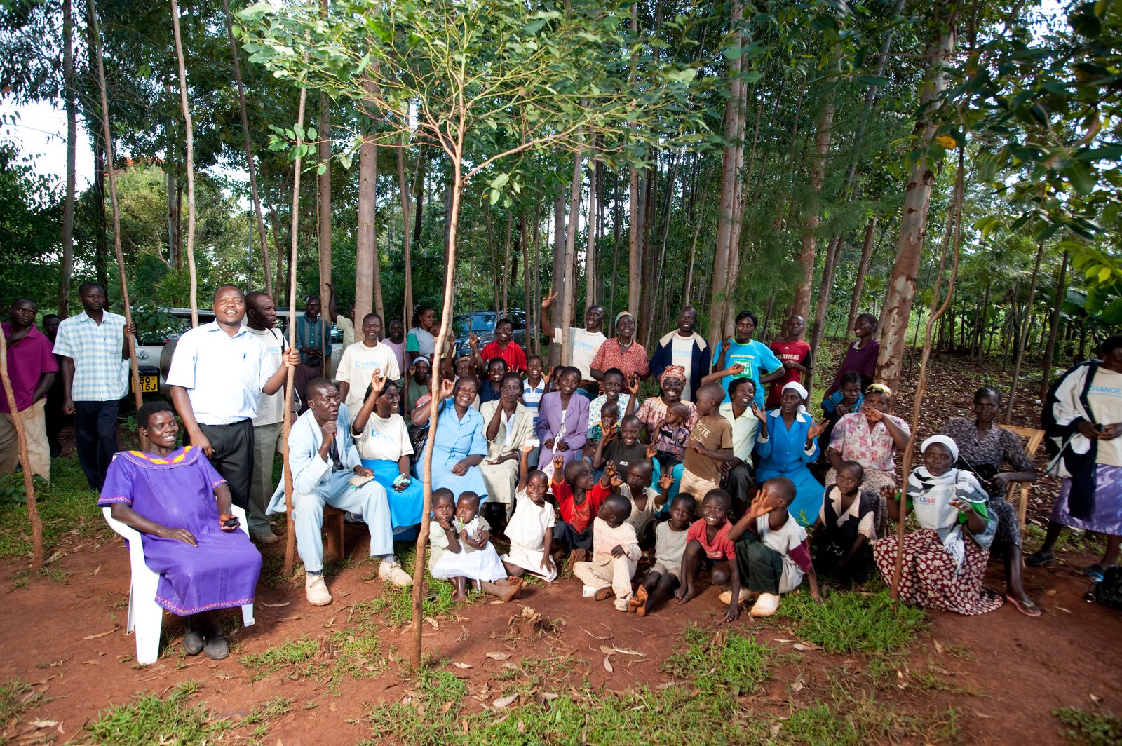 Kenyan men, women, and children posing for a group picture.