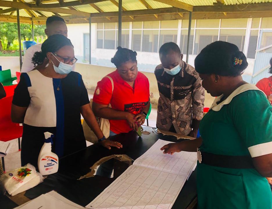 PATH and Ghana Health Service staff discuss the Integrated Antenatal Care project