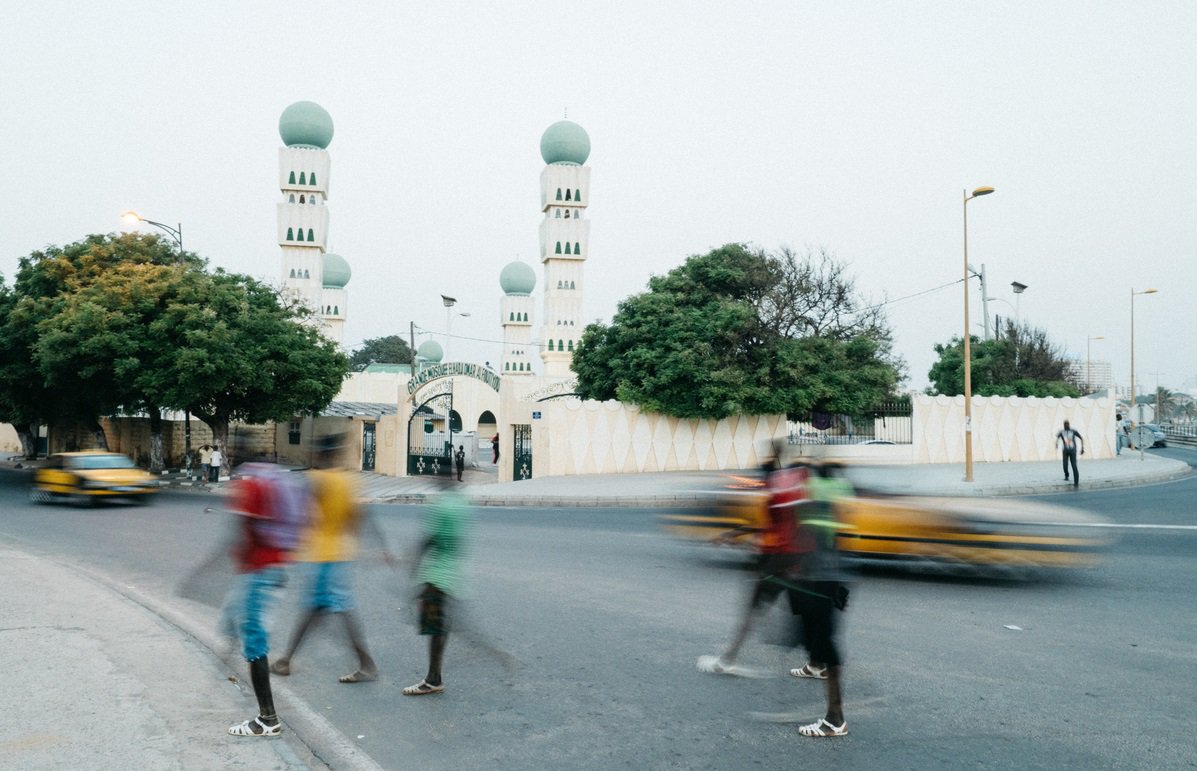 People walking on the street in Dakar, Senegal.