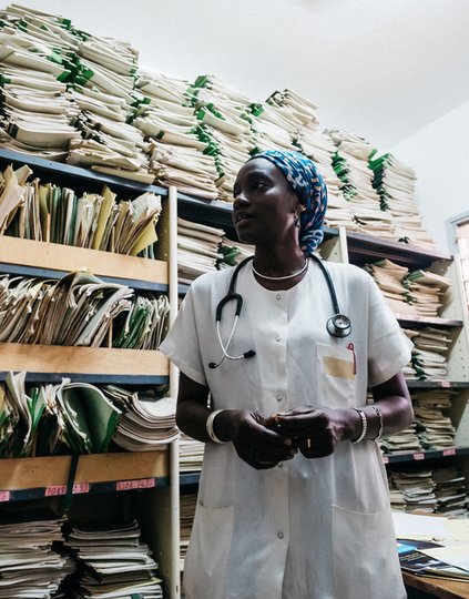Dr. Maimouna Ndour Mbaye, a diabetes specialist, standing in a records room at the Marc Sankale Diabetes Center in Dakar, Senegal. Photo: PATH/Gabe Bienczyck