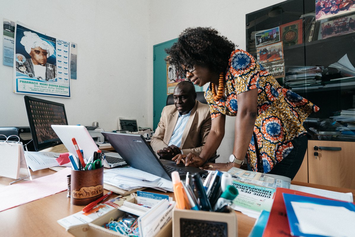23650.jpeg A PATH staff member meets with Dr. Madické Diagne, chief of the inspection division of Senegal’s Bureau of Pharmacy and Medications. PATH/Gabe Bienczycki