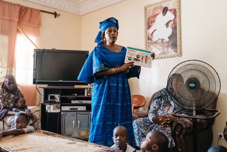 Coumba Diouf leads community training on malaria Photo: PATH/Gabe Bienczycki