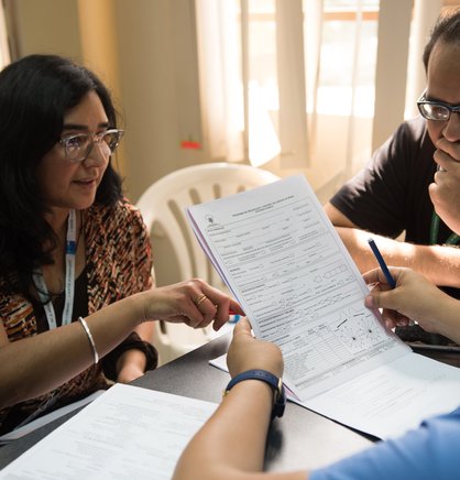 PATH Peru National Project Coordinator Ines Contreras, Dr. Jose Seminario, Dr. Adela Escobedo (side of head) at a training for early breast cancer detection.
