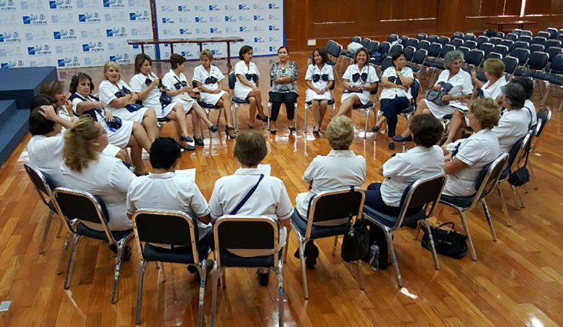 A group of hospital volunteers in a circle.