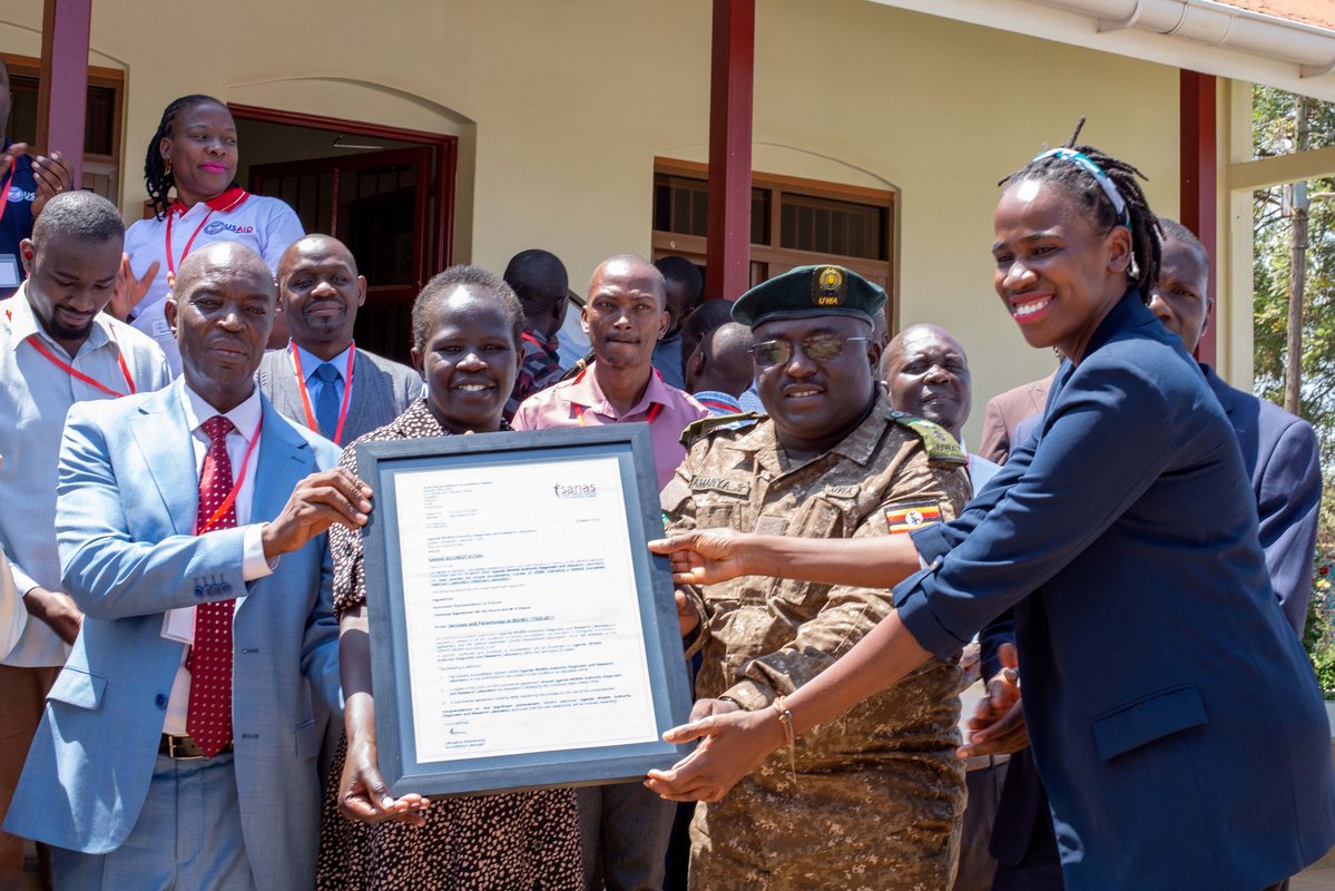 Staff of Mbale Diagnostic Vet Lab and the Uganda Wildlife Authority Diagnostic and Research Vet Lab receive their accreditation certificates in Mbale City. Photo: PATH/ Deogratias Agaba.
