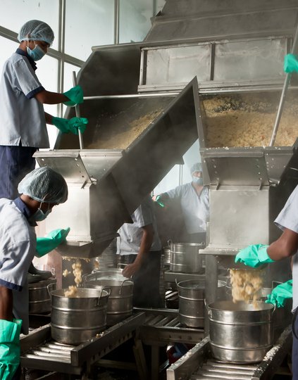 Fortified rice being cooked for a school lunch program in India. PATH provides technical expertise for scale-up of fortified rice, supply chain optimization, quality assurance and control, social behavior change, evidence generation, and more. Photo:PATH.