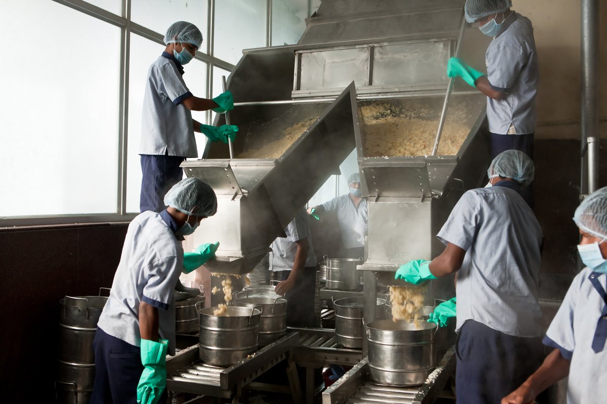 Fortified rice being cooked for a school lunch program in India. PATH provides technical expertise for scale-up of fortified rice, supply chain optimization, quality assurance and control, social behavior change, evidence generation, and more. Photo:PATH.