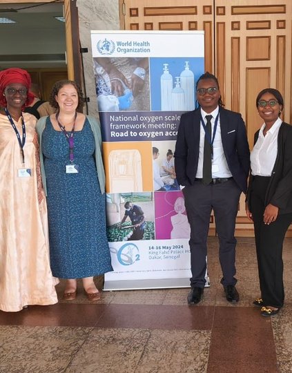 PATH staff at the May 2024 World Health Organization National Oxygen Scale-Up Framework Meeting. Left to right: Lisa Smith, Ndeye Astou Badiane, Carrie Hemminger, Raphael Kayambankadzanja, Inutu Kanyama, and Jayendra Kasar. Photo: PATH.