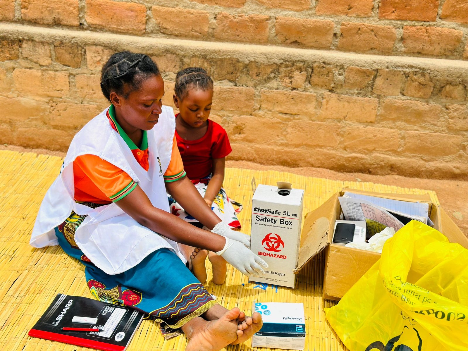 Data Community Health Worker Annie Mwale tests a child for malaria in Petauke district, Zambia. Annie is responsible not only for recording test results from her community, but also for aggregating data from four other CHWs. Photo: PATH/Mukomela Banda