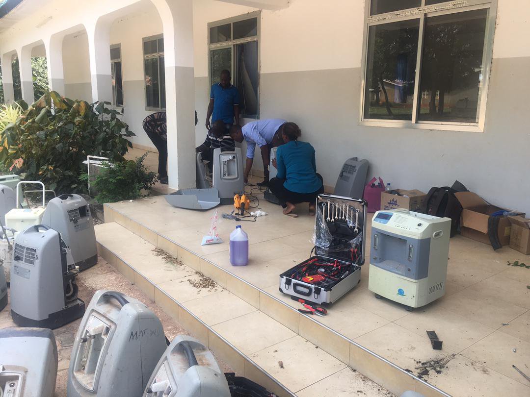 Bioengineers at work fixing faulty medical oxygen equipment at the Urambo District Hospital in Tabora, Tanzania. Photo: PATH/Deusdedit Mjungu.