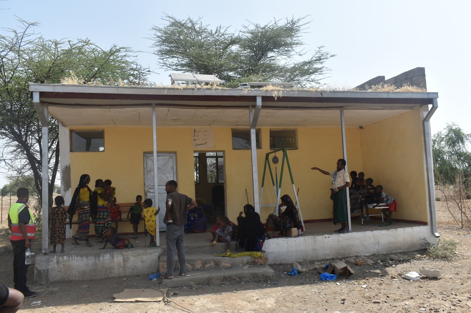 ETH_Community members excited to see a nearby health post restored by PATH