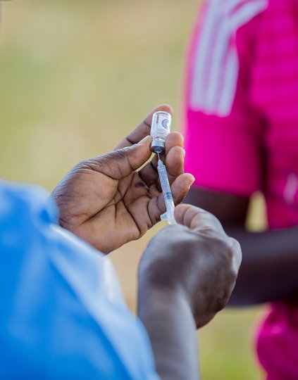 A health surveillance assistant prepares a dose of typhoid conjugate vaccine during Malawi's vaccine introduction campaign in 2023. Photo: PATH/Madalitso Mvula