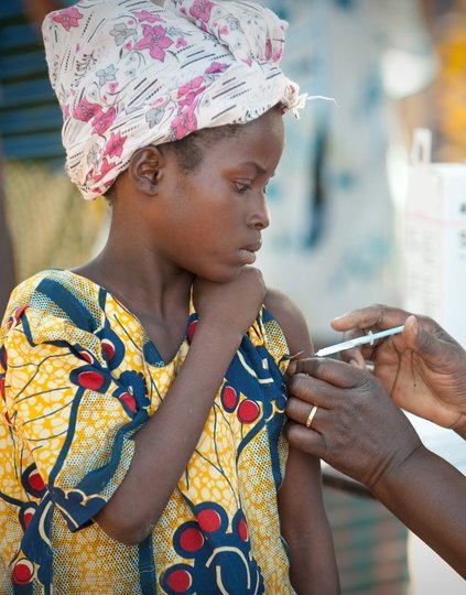 Young woman receiving a vaccine at the MenAfriVac launch.
