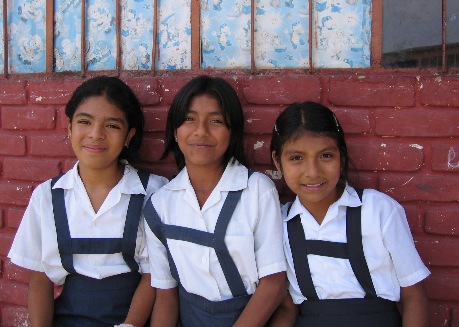 Three girls in school uniforms.