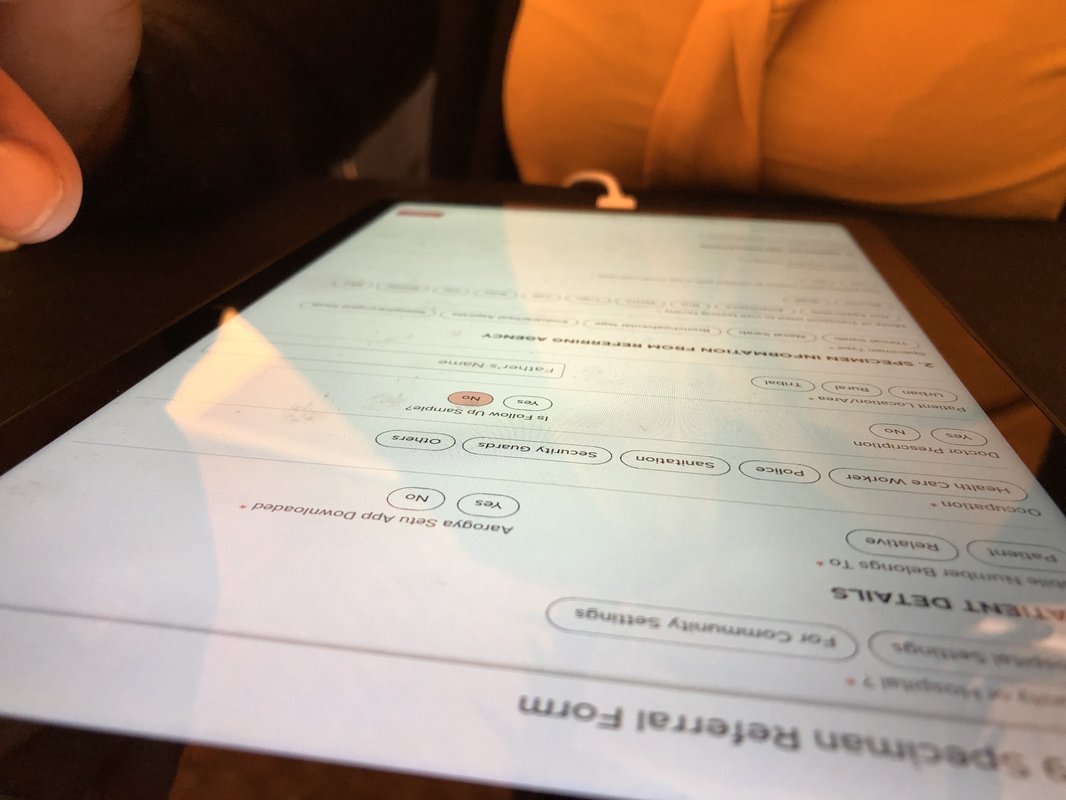 A health care worker testing the Connection Loops COVID-19 data management tool. Photo: PATH/Tony Mapulanga.