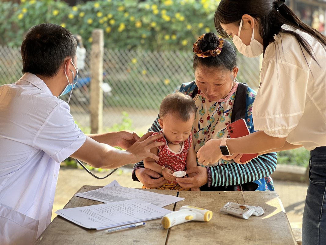 Health care workers conduct a supportive supervision session at a vaccination point in Tuan Giao district, Dien Bien province, Vietnam.