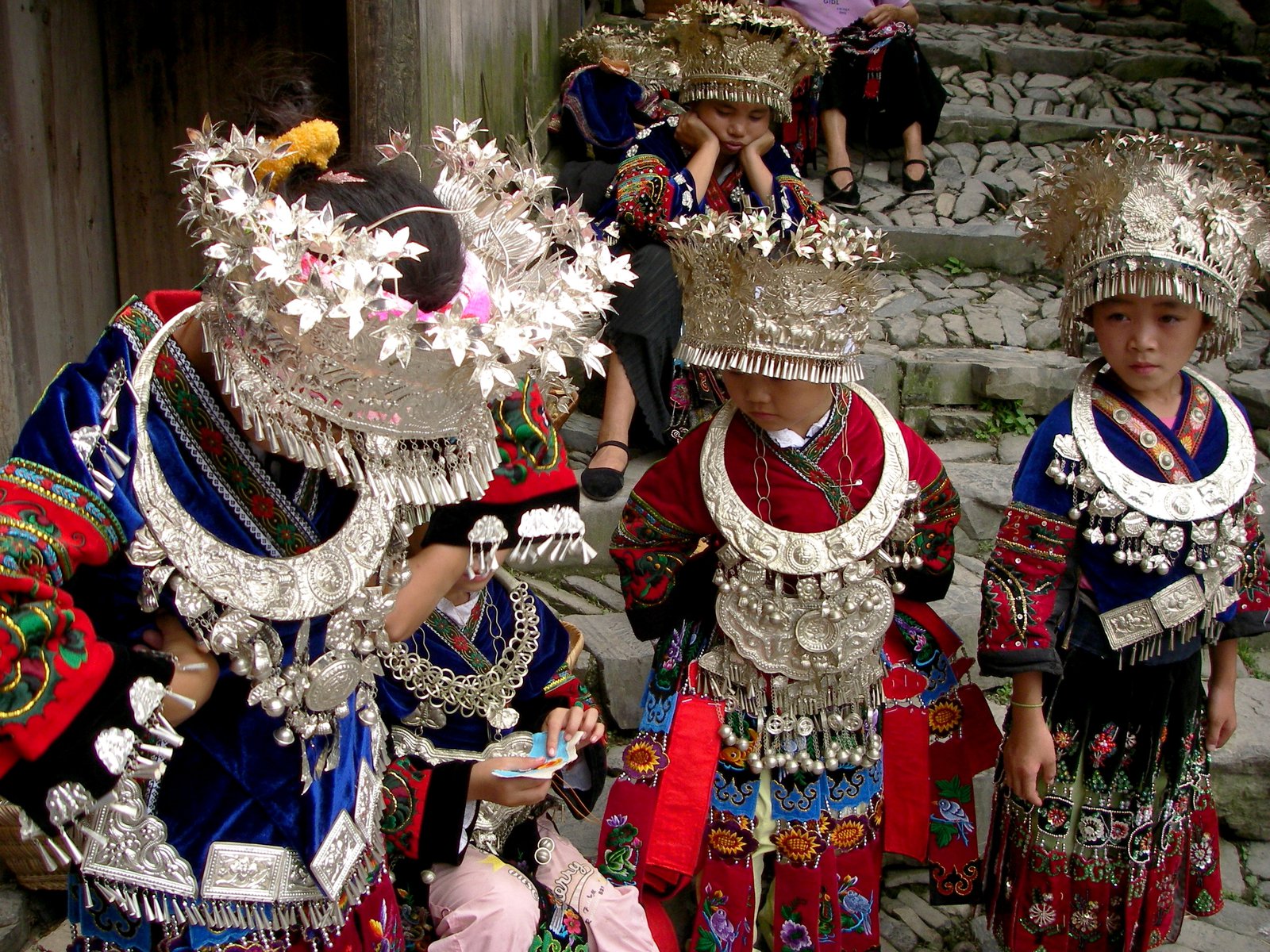Four young girls in full regalia.