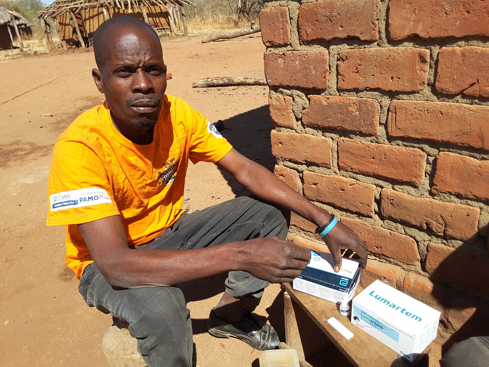 Masauso Mbewe at his home in Lusangazi District, preparing for a community case management session. Photo: PATH.