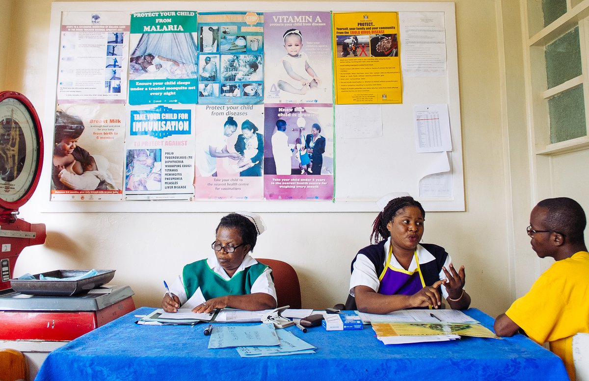 MB-18228-2000pxcrop.jpg A patient, James Musenda (right), discusses nutrition with Rebecca Anne Saiko, a nurse trained in nutrition assessment, counseling, and support by the Thrive Project in Mopani Chamboli Clinic in Zambia. PATH/Gabe Bienczycki