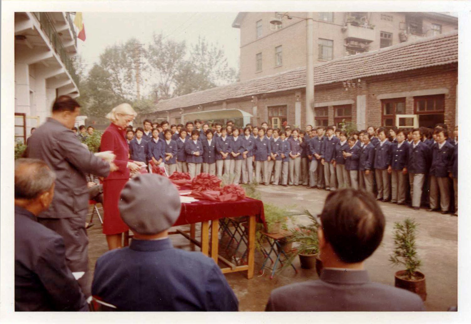 Peggy Morrow, PATH’s first full-time employee, participates in a ribbon-cutting ceremony at a Chinese contraceptive manufacturing facility in the early 1980s.