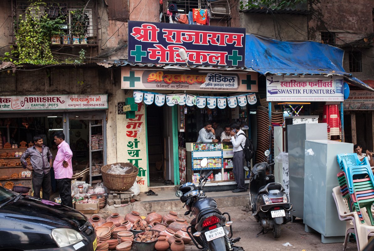 The front of a pharmacy on a busy street in Mumbai.