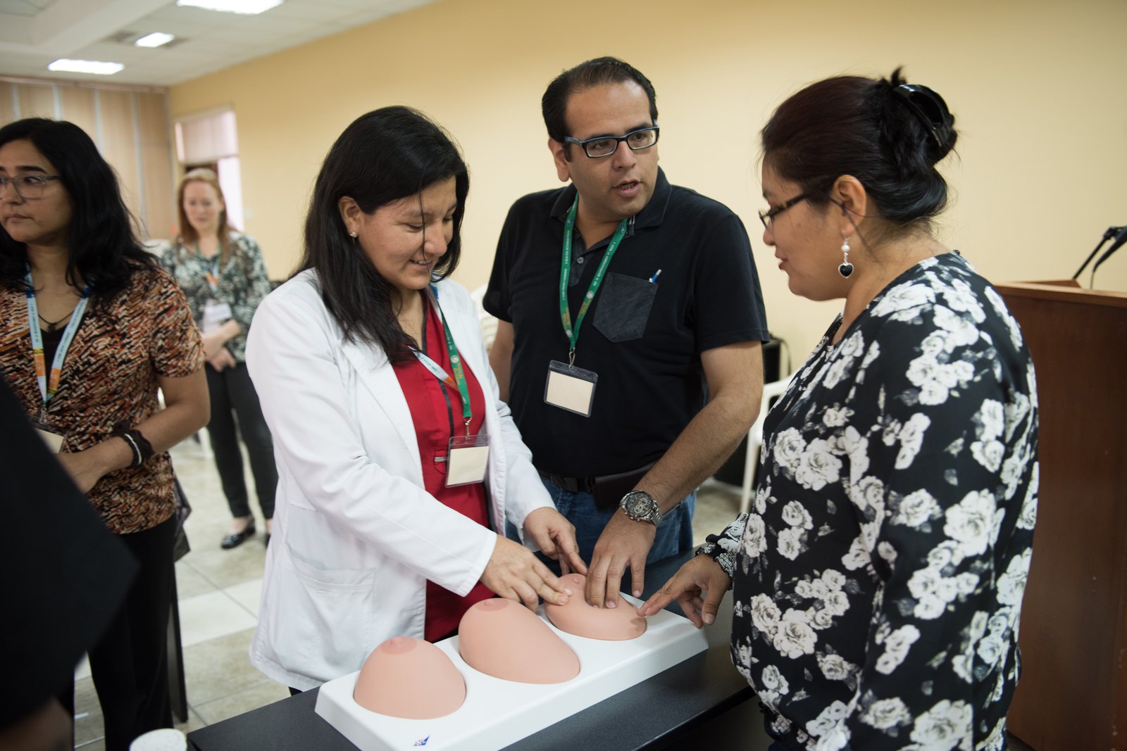 Doctors practice clinical breast exam techniques in Peru.